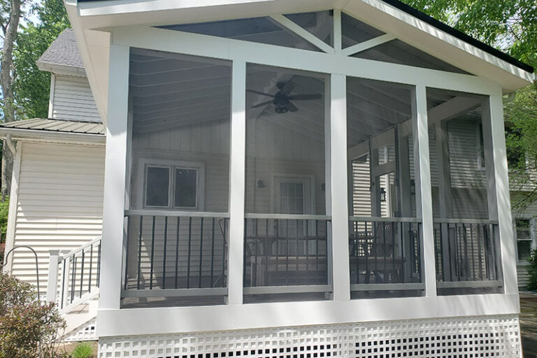 screened in porch with vaulted ceiling
