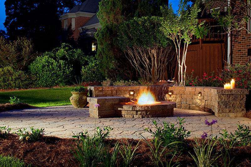 Firepit, stone seating, wall, and paver patio, outdoor lighting, ambiance lighting