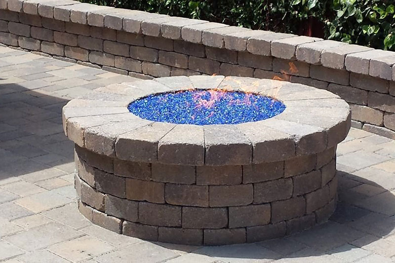gas firepit, stone wall, paver patio