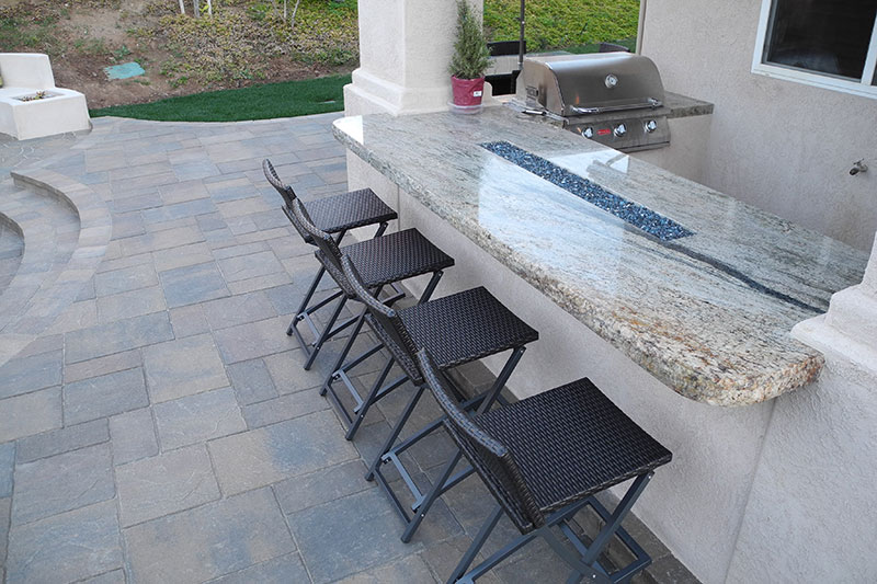 outdoor living with table with fire feature