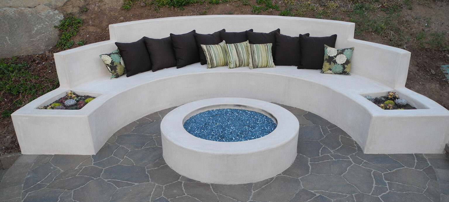 firepit with built in cement seating and paver patio
