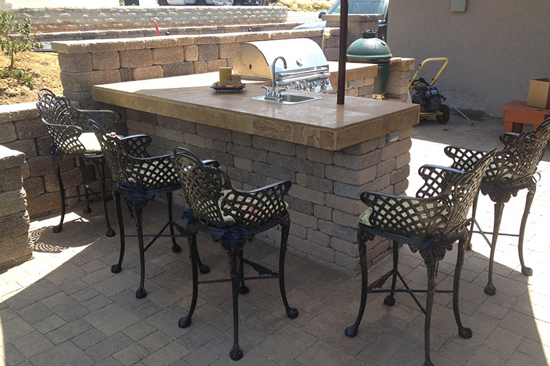 Outdoor kitchen with counter, grill