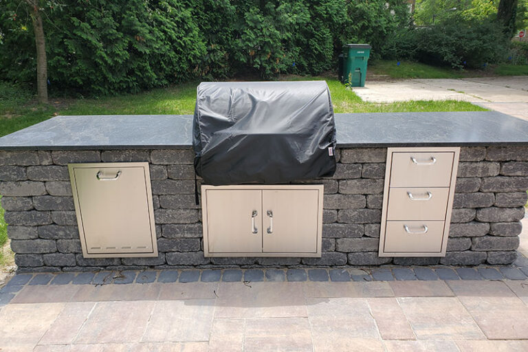 Outdoor kitchen with grill and counters