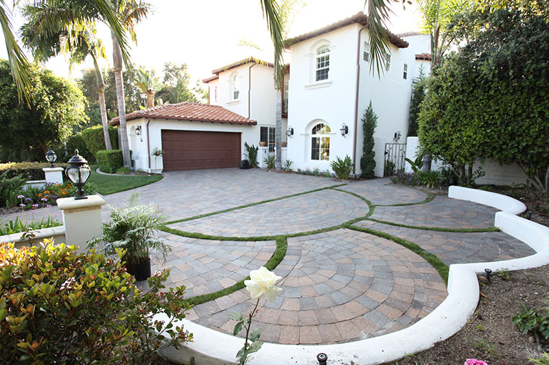 luxury paver driveway with grass dividers