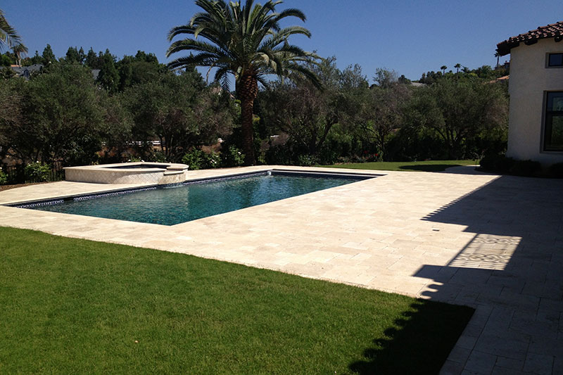 paver patio around luxury pool