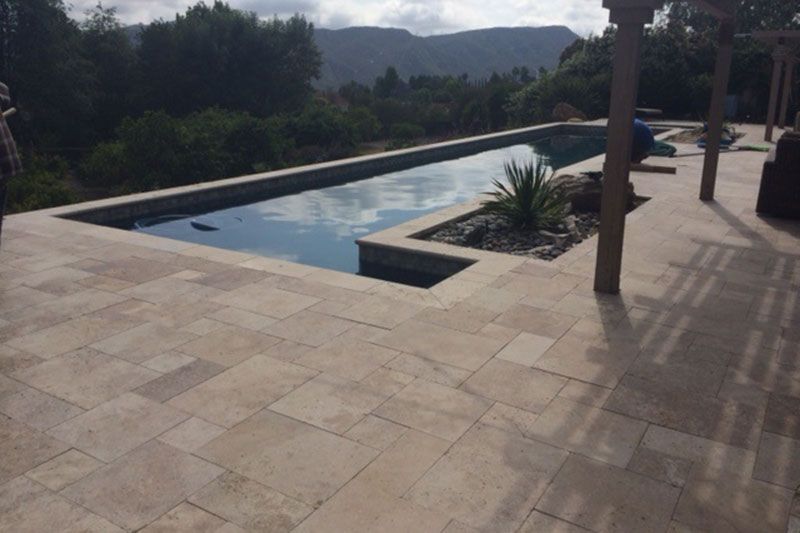 paver patio around luxury pool