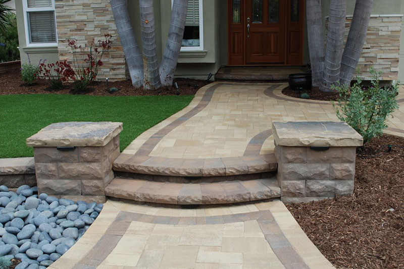 stone wall, stairs, paver pathway with accent edge